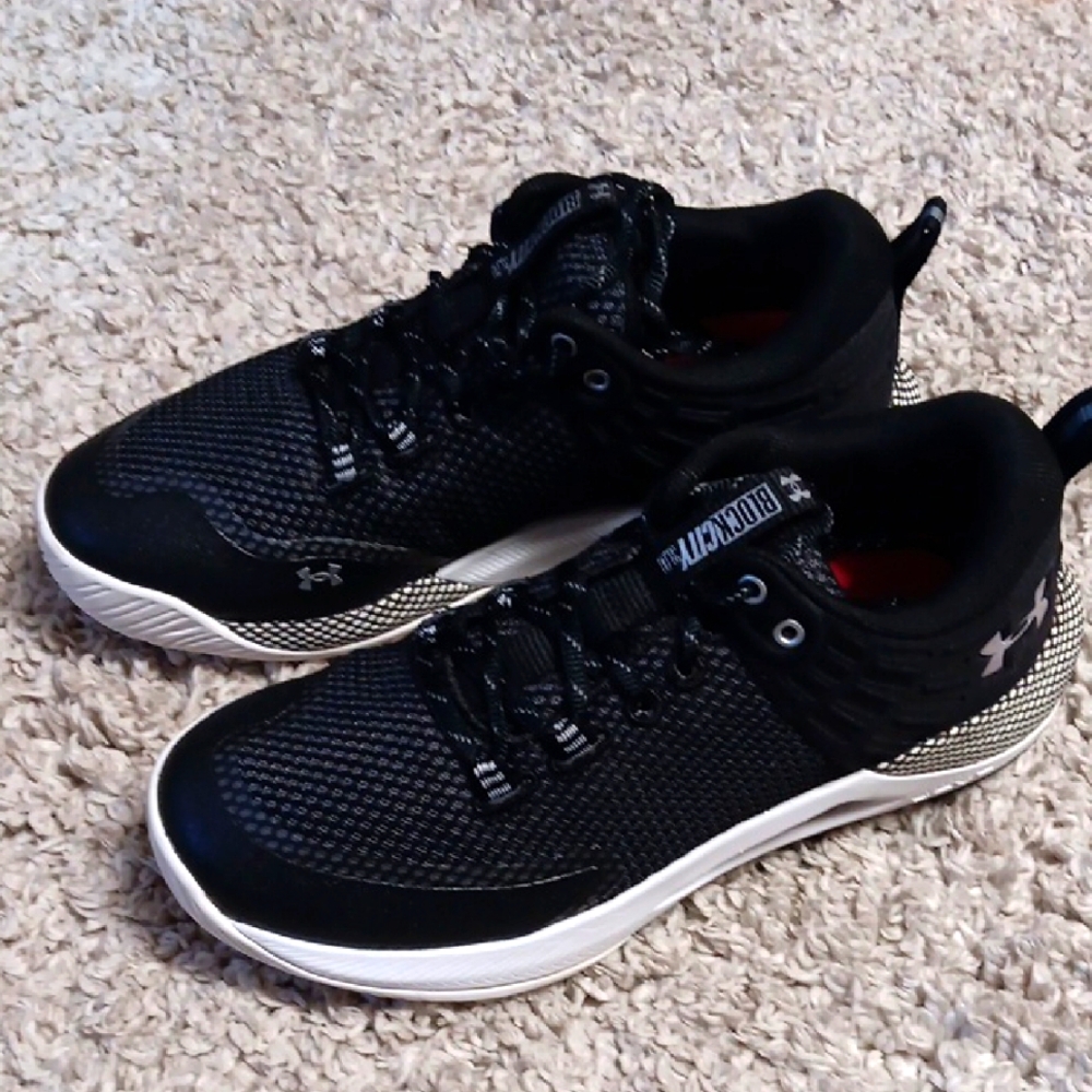 Under Armour Black and White Athletic Shoes with Modern Design